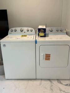 two machines sitting next to each other on a counter at The Vineyard House | Spacious Home Near Wine, Beer & Lake MI in Bridgman