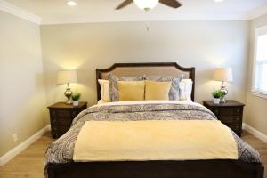 a bedroom with a large bed with two night stands at Adorable 3 Bedroom 2 Bath Home in Fullerton