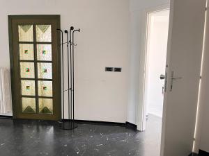 a white room with a door and a window at Appartamento Arena by OTIUM in Giulianova +33 photos