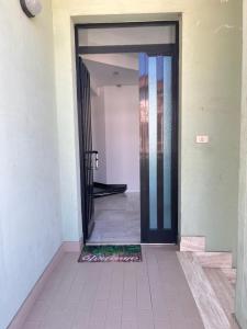 an open door into a hallway with a tile floor at Appartamento Arena by OTIUM in Giulianova