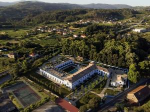 an aerial view of a building in a vineyard at Oca Grande Hotel Do Pezo in Melgaço