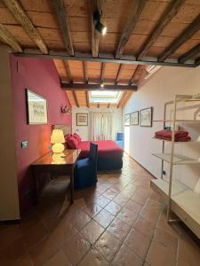 a bedroom with a bed and a table in a room at Villa Santa Chiara in Siena +259 photos