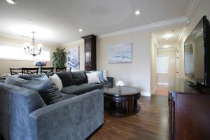 a living room with a couch and a table at Comfy Pool Home,1/4 mile Walk To Disneyland in Anaheim