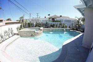 a swimming pool in the middle of a house at Stunning 8 bedroom 6 bathroom Pool Home in Anaheim