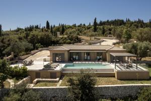 an aerial view of a house with a swimming pool at Villa Ouranos by Villa Select in Fiskardo