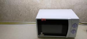 a microwave oven sitting on top of a counter at Imperial resident time Square KL in Kuala Lumpur