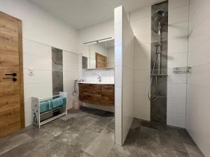 a bathroom with a shower and a sink at Panoramablick Zirbitzkogel in Perchau am Sattel +36 photos