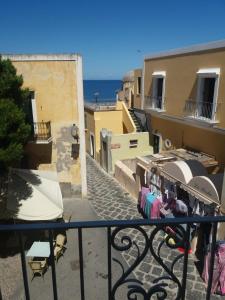 a view of a street with clothes hanging on a balcony at Affittacamere Via Muraglione in Ventotene