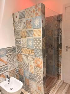 a bathroom with a shower and a sink at Sala dell Estate Guest House in Secchia +167 photos