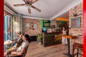 a group of people sitting in a restaurant at YOLO Hostel in Istanbul