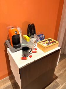 a table with a blender and other items on it at Sala dell Estate Guest House in Secchia