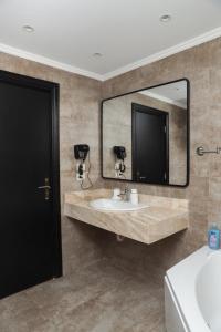 a bathroom with a sink and a mirror at Munir’s residence in Cairo +152 photos