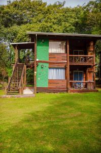 a small house with a green and brown at Posada La Solana in El Cadillal +13 photos