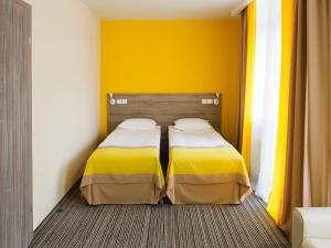 Postel nebo postele na pokoji v ubytování Raziotel Kyiv Yamska