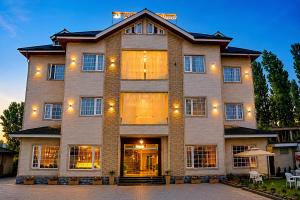 a large brick building with the front of it at Alasha Retreat in Srinagar