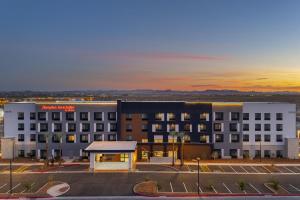 an aerial view of a hotel with a parking lot at Hampton Inn & Suites By Hilton Buckeye Phoenix in Buckeye