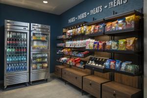 a grocery store aisle with shelves of food and drinks at Hampton Inn & Suites By Hilton Buckeye Phoenix in Buckeye