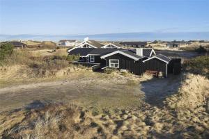 an aerial view of a house on the beach at LN1094-Hirtshals-Strandklitten-2 in Hirtshals