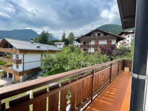 a balcony with a view of a city at Casa Cadore Grea in Grea