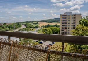 a view of a city from a bridge with a building at Korbzimmer Apartment in Lichtenfels