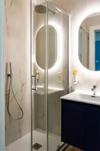 a bathroom with a shower and a sink at La Dimora Imperiale in Rocca Imperiale