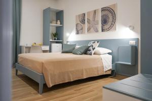 a bedroom with a bed in a room at La Dimora Imperiale in Rocca Imperiale