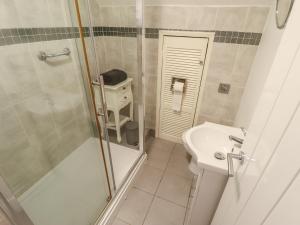 a bathroom with a shower and a sink at Sandringham in Withernsea +23 photos