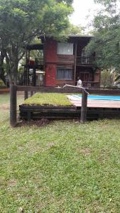 a house with a pool in front of it at Posada La Solana in El Cadillal