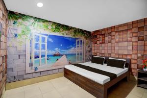 a bedroom with a bed in a room with a window at Hotel O Refinery Road Panipat Formerly Quinn in Pānīpat