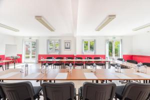 a large room with tables and chairs in it at TheOriginals City, Hôtel restaurant l'Ormichal Dijon Sud in Marsannay-la-Côte +69 photos