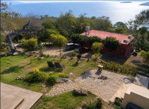 an aerial view of a house with a yard at Domo Abitare Glamping in Isla de Mezcala