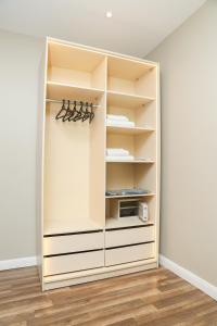 a closet with white walls and white shelves at Munir’s residence in Cairo