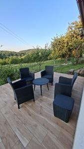 a group of chairs and a table on a patio at Chata Chotár Nová Baňa in Veľká Lehota +14 photos