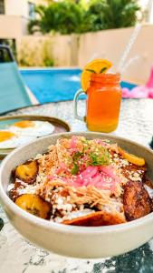 a bowl of food sitting on a table at Hotel Boutique Mura in Cancún