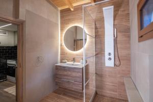 a bathroom with a sink and a mirror at MARIA'S Roof Top View in Poros +13 photos
