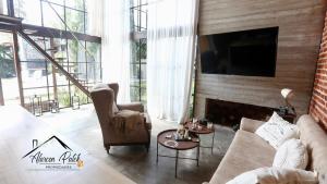 a living room with a couch and a fireplace at Loft Estilo Industrial in Ezeiza