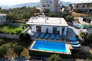 an aerial view of a house with a swimming pool at Amar Seaside in Ksamil