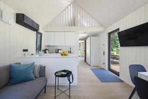 a kitchen and living room in a house at Kasispea Meremaja in Kasispea +26 photos