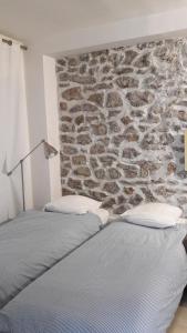 Кровать или кровати в номере Villa des iris