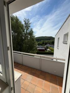 an open door to a balcony with a view at Das kleine Zuhause 1 in Bad Driburg