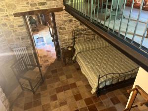 an attic bedroom with a bed and a staircase at Il Convento di Roberta in Civitanova del Sannio +8 photos