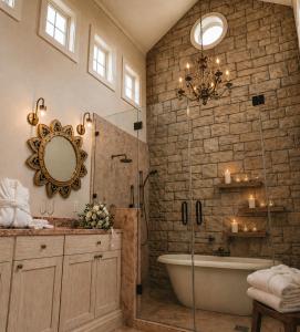 a bathroom with a bath tub and a mirror at Domaine Chardonnay in Temecula +105 photos