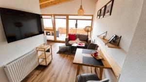 a living room with a couch and a table at MY APARTMENT krinzwald in Seefeld in Tirol