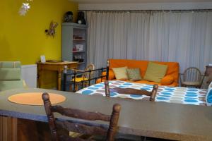 a living room with a bed and a couch at The Little Hatbox in Newburgh