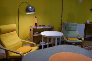 a living room with two chairs and a table at The Little Hatbox in Newburgh