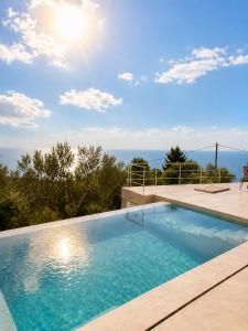 a swimming pool on top of a house at Tellion Villas-Member of My Villas Hospitality in Agios Nikitas