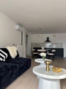 a living room with a couch and a table at Prenočišče Henrik in Dolenjske Toplice