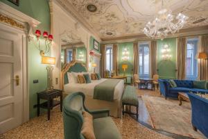 a bedroom with a bed and a living room at Palazzo Trezza in Verona