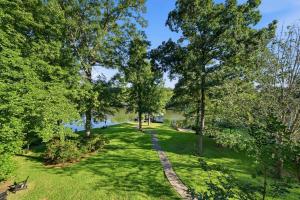 an overhead view of a park with trees and a path at The Sinclair House Private Lake Retreat in Milledgeville