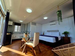 a bedroom with a bed and a glass table at Abitare lodge Mezcala #2 in Isla de Mezcala